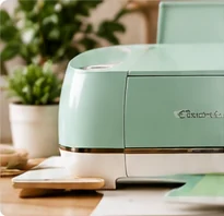 Mint green cutting machine on a crafting table